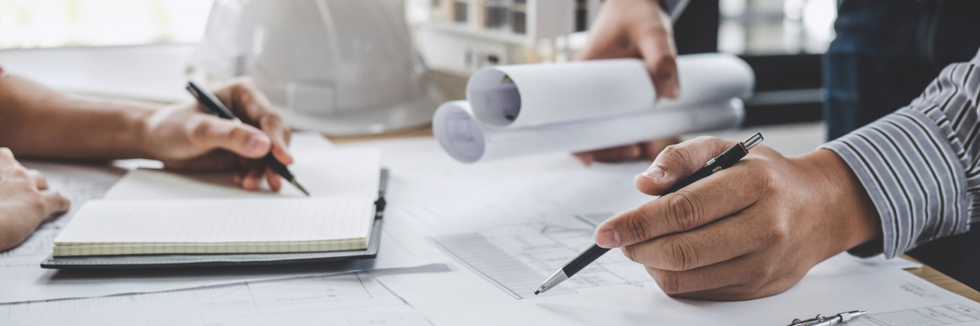 Construction and structure concept of Engineer or architect meeting for project working with partner and engineering tools on model building and blueprint in working site.